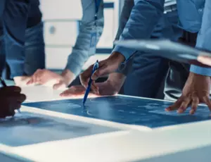 Man using a pen on a screen