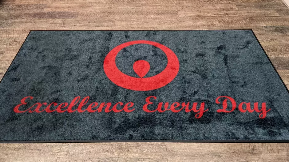 Excellence Every Day written on carpet