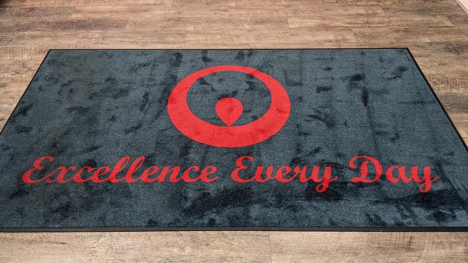 Excellence Every Day written on carpet