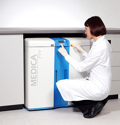 Woman programming a Medica unit